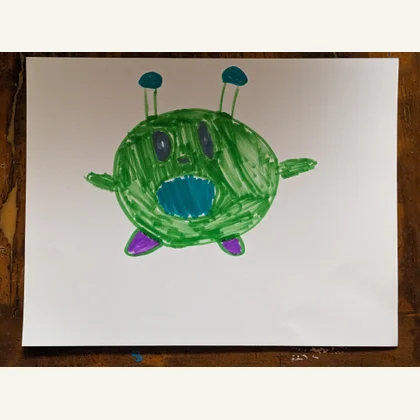 An original child’s drawing of a green gatekeeper with antenna eyes and purple feet.